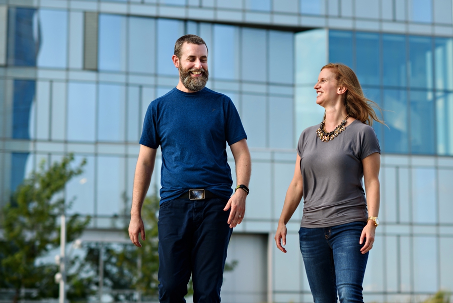 A podcast team walking in front of a building in Philadelphia.